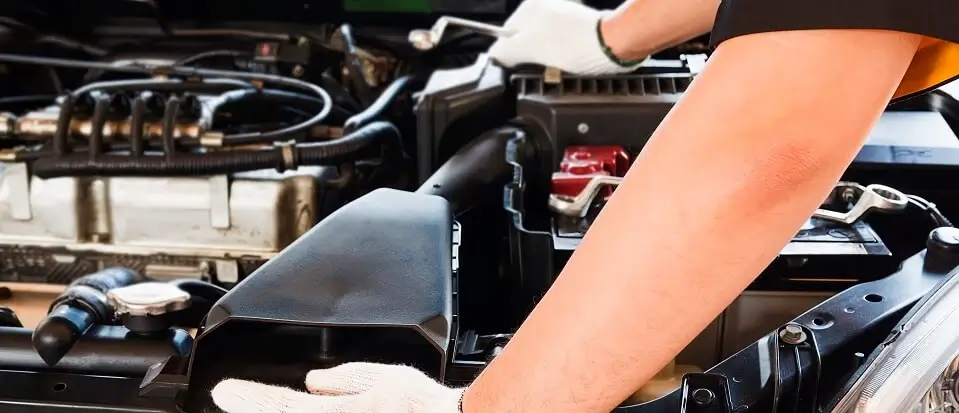 Mechanic Checking Car Battery