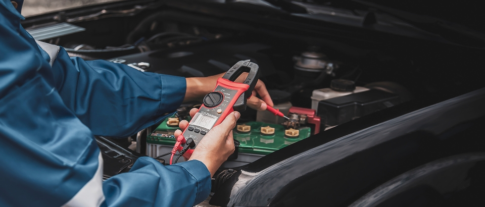 technicians inspect car electrical system