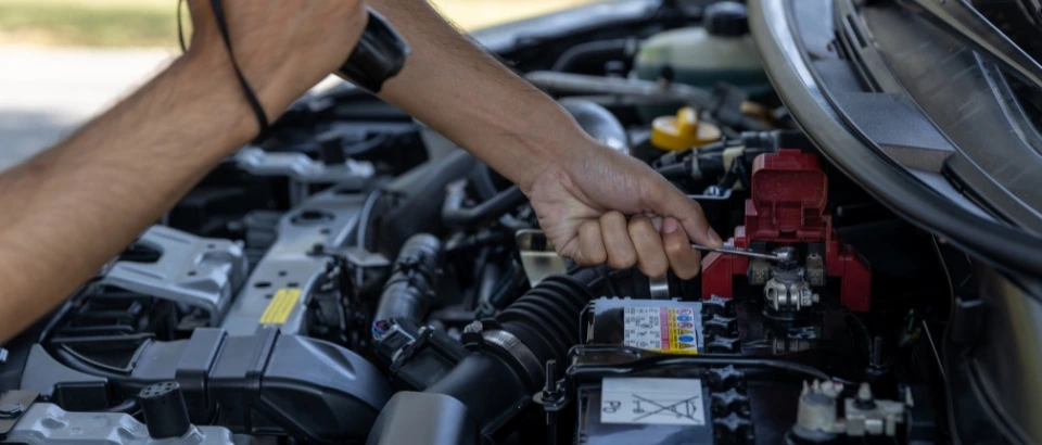 Man is Checking Car Battery
