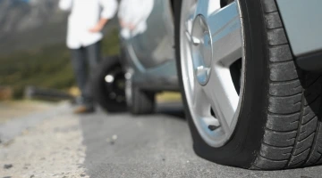 men Stuck on Road with tyre puncture